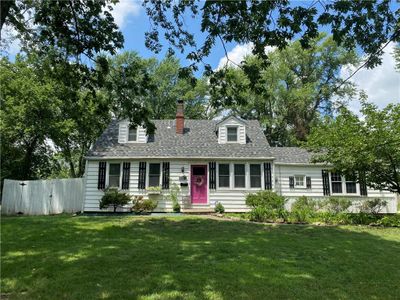 Cape cod home with a front lawn | Image 1