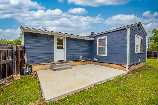 Back of house with fence, a patio, and a lawn | Image 26