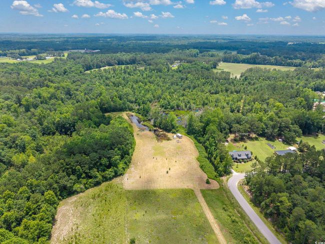 Aerial view of property and surrounding area with a heavily wooded​​‌​​​​‌​​‌‌​‌‌​​​‌‌​​‌‌​‌​​​​​‌ area | Image 10