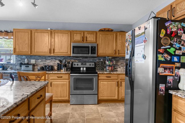 10457 Cranston St, House other with 5 bedrooms, 2 bathrooms and null parking in Spring Hill FL | Image 8