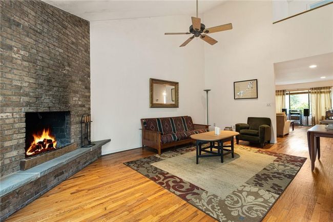 Living room with stone fpl & hardwood floors | Image 10