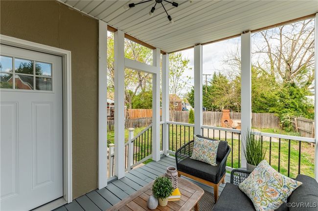 Sunroom / solarium with a healthy amount of sunlight and a ceiling fan | Image 48