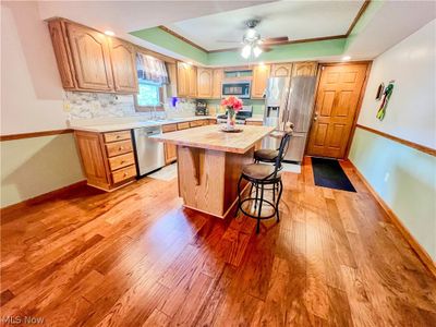 Kitchen with stainless steel appliances, and decorative backsplash | Image 3