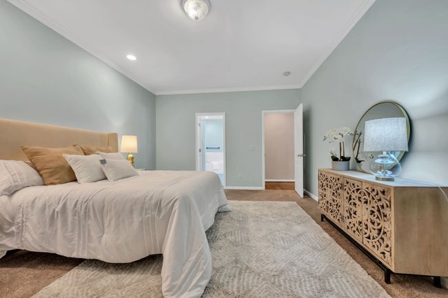 SPACIOUS & PRIVATE Primary Suite on Main Level featuring a Spa-Worthy Bathroom | Image 21