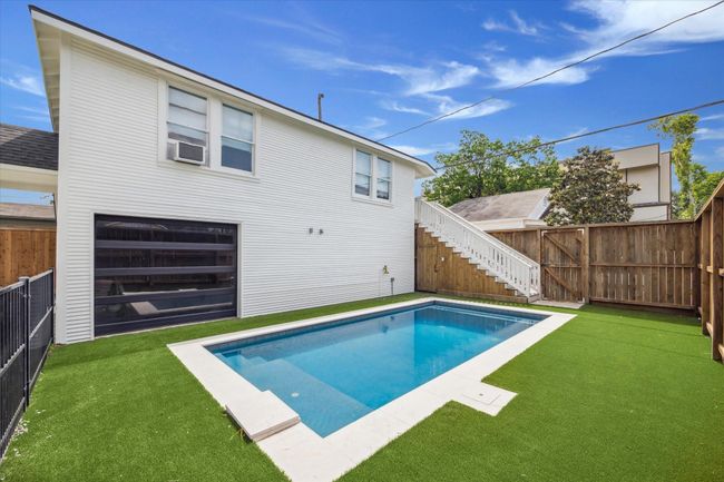 View of pool with separate garage access | Image 49