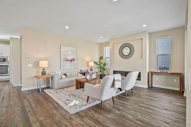 Spacious family room at main level with kitchen and entertainment balcony | Image 9