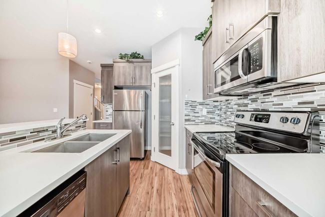 23 Baysprings Way Sw, Home with 3 bedrooms, 3 bathrooms and 1 parking in Airdrie AB | Image 16