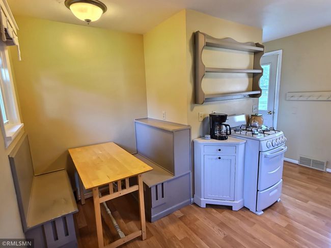 The custom breakfast nook is extremely practical and takes up minimal space in the kitchen. | Image 9