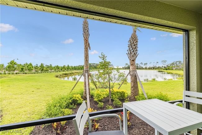 View of grassy yard featuring a water view | Image 27