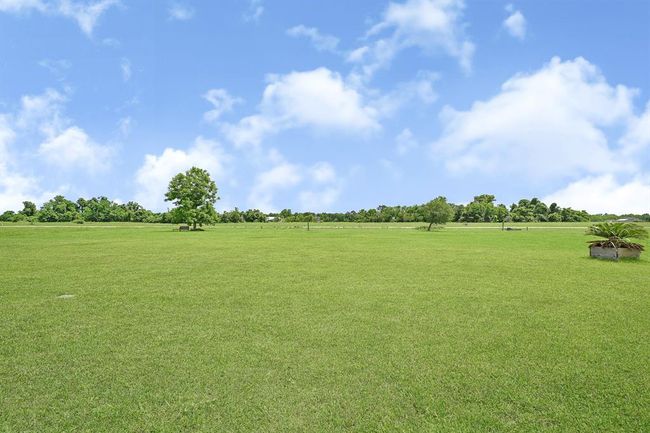 Backyard, plenty of space for a pool. | Image 47