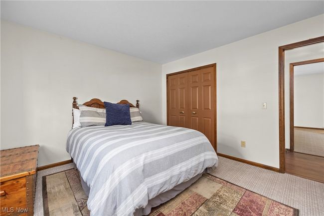 Bedroom 3 with a closet and carpet flooring | Image 26