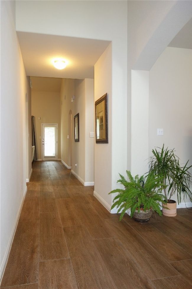 Hallway. Notice the exquisite Spanish porcelain tile with wood texture. | Image 4