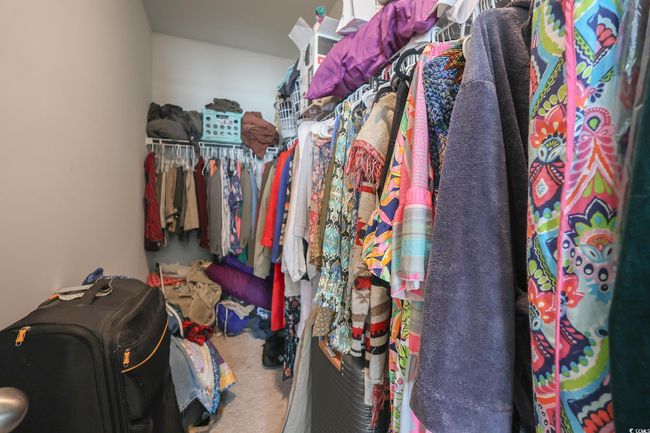 Spacious closet featuring carpet | Image 15