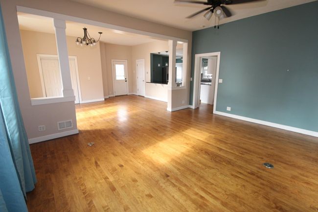 Living and Dining Room open concept. Exterior door in dining room leads to outside deck. | Image 8