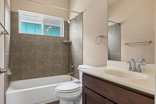 Shared full bath on top floor | Image 28