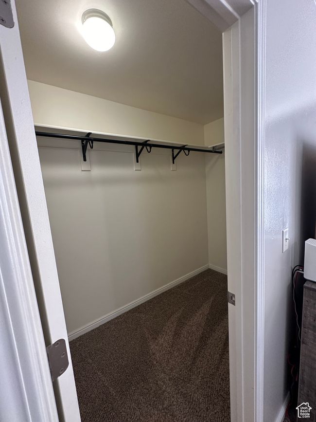 Spacious closet with carpet | Image 16