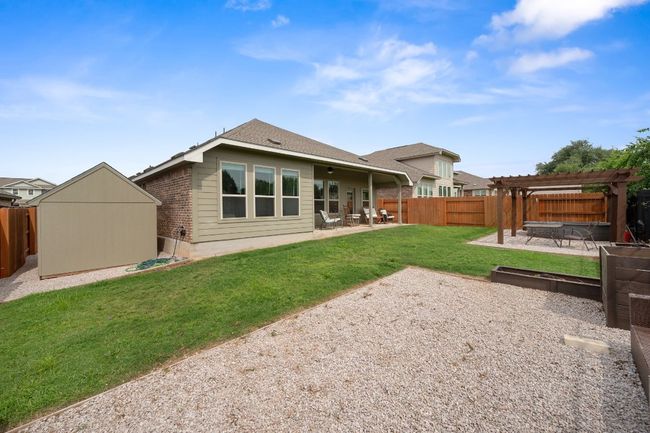 Back of house with a pergola, a patio, and brick siding | Image 24