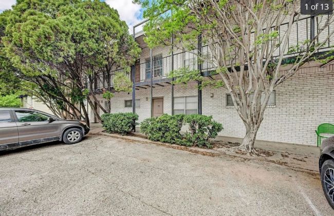 View of front of house featuring brick siding and uncovered parking | Image 4