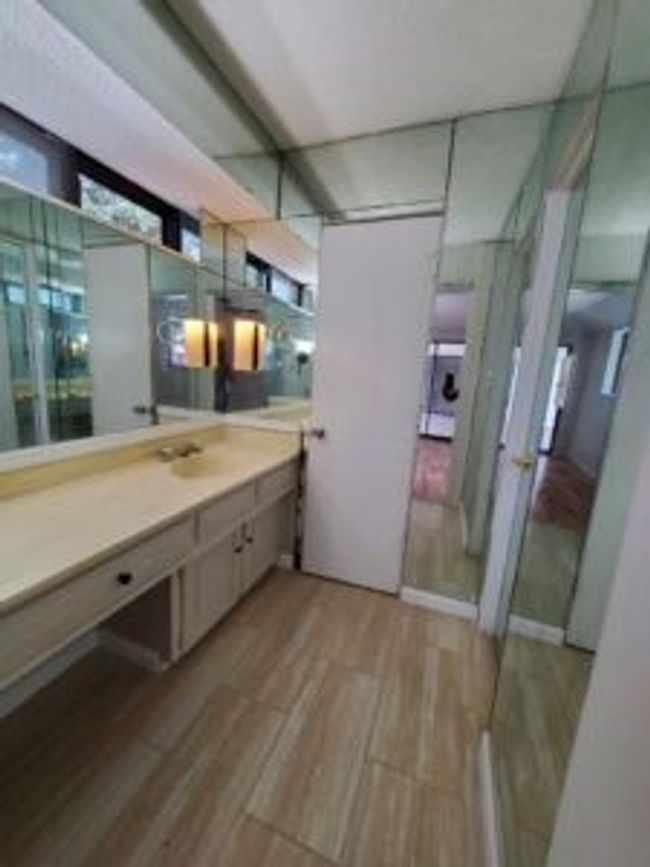 Bathroom with wood finished floors and vanity | Image 30