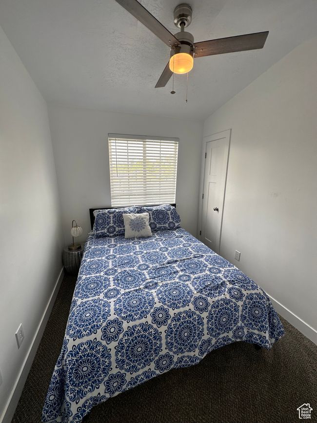 Bedroom featuring carpet, baseboards, and a ceiling fan | Image 29