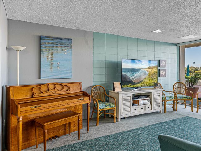 PIANO AND TV IN COMMUNITY GATHERING ROOM | Image 30