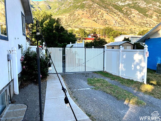 View of gate featuring fence and a mountain view | Image 60