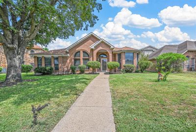 View of front facade with a front lawn | Image 1