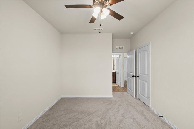 Empty room featuring light carpet and ceiling fan | Image 19