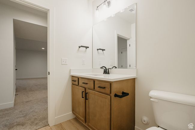 Bathroom featuring toilet and vanity | Image 32