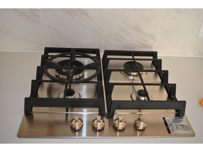 Room details with stainless steel gas cooktop | Image 7