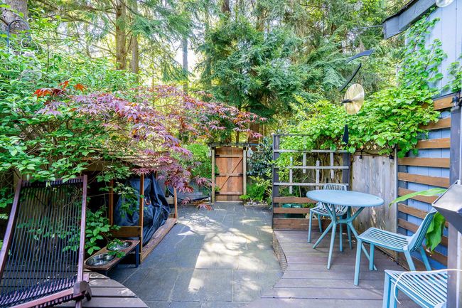 Wooden terrace featuring a gate and fence | Image 24