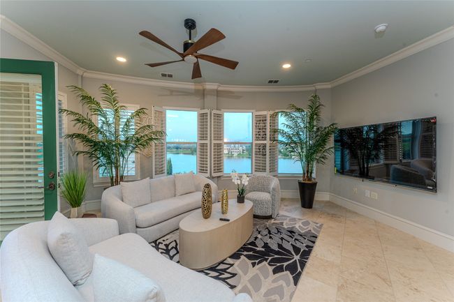 Living room with a ceiling fan, recessed lighting, and ornamental molding | Image 13