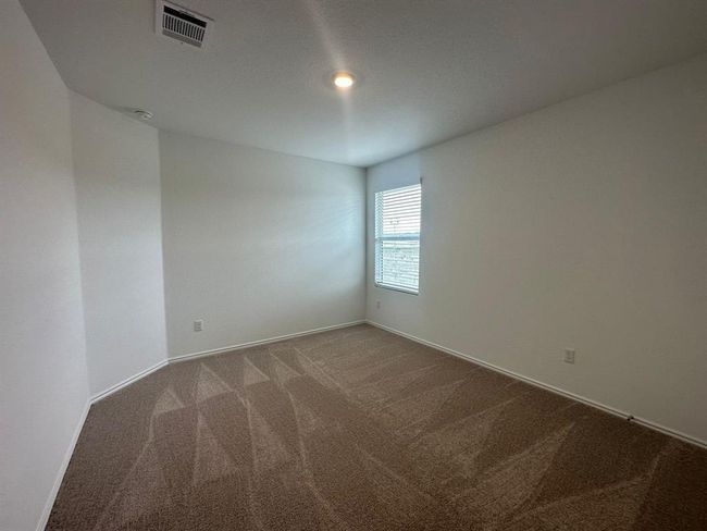 Carpeted spare room featuring baseboards | Image 5