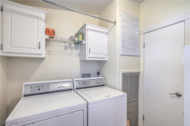 Laundry room with washing machine and dryer and cabinet space | Image 26