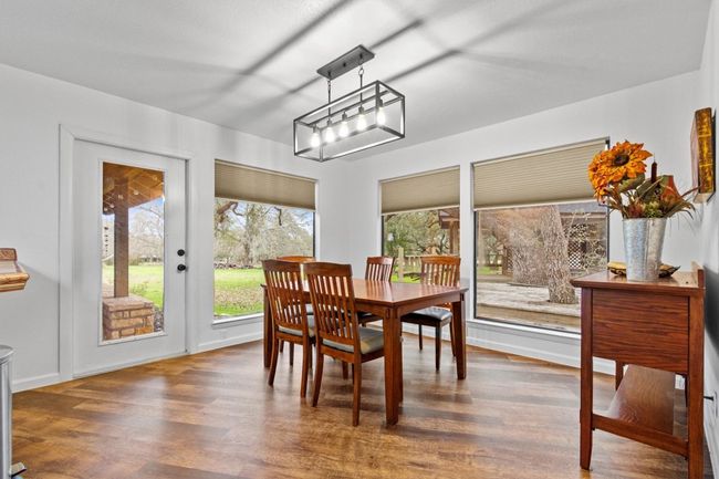 Dining area featuring dark hardwood / wood-style floors | Image 14