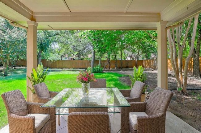 Fenced backyard featuring outdoor dining space | Image 10