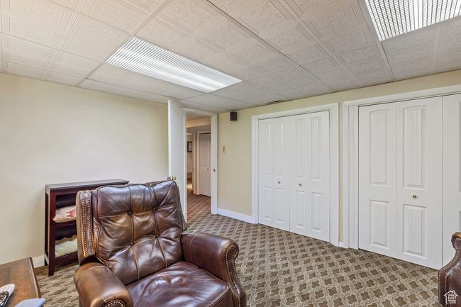 Living area with carpet flooring and baseboards | Image 17