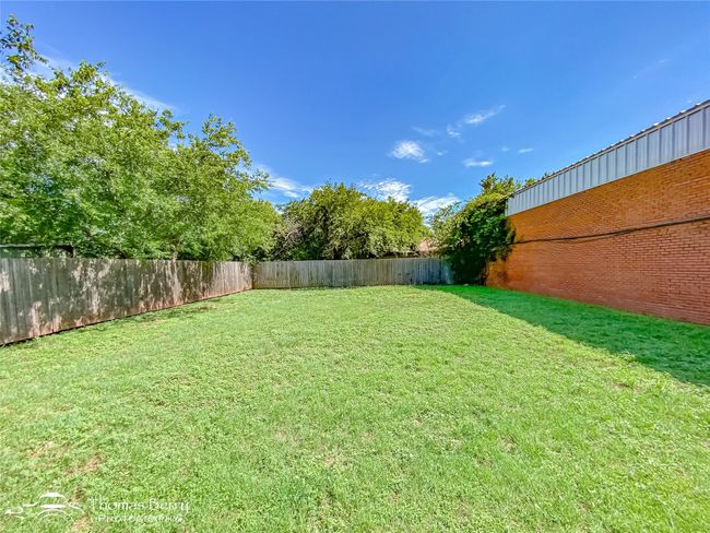 View of fenced backyard | Image 31