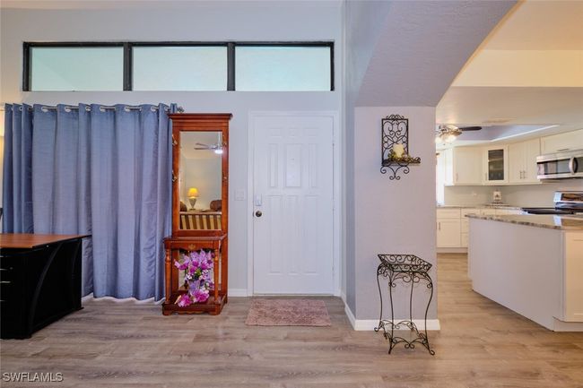 Foyer featuring light wood-style floors and a ceiling fan | Image 11