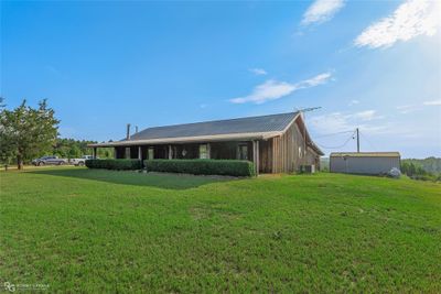 Ranch-style home featuring a front lawn | Image 1