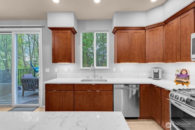 quartz counters and beautiful wood cabinetry | Image 7