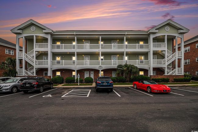 Property at dusk with stairs and parking | Image 21