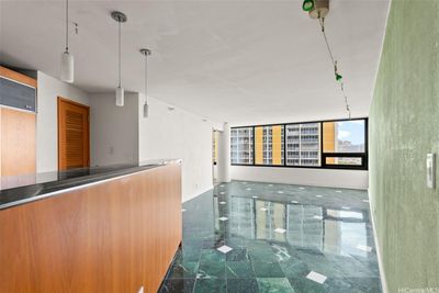 entry to kitchen, dining area, and living area | Image 3