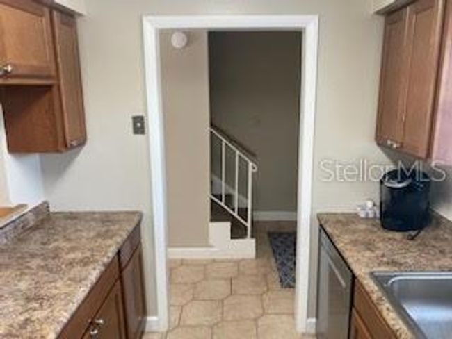 Kitchen w/ view toward hall & entry | Image 5