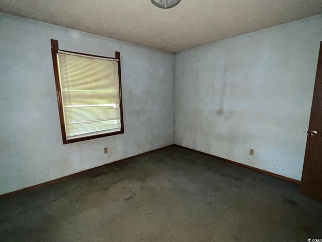 Carpeted empty room with baseboards | Image 17