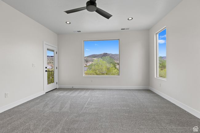 Carpeted spare room featuring recessed lighting, baseboards, ceiling fan, and visible vents | Image 9