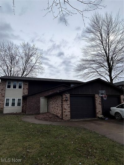 View of front of house with a garage and a front yard | Image 3