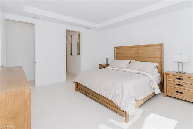 Bedroom with a tray ceiling | Image 19