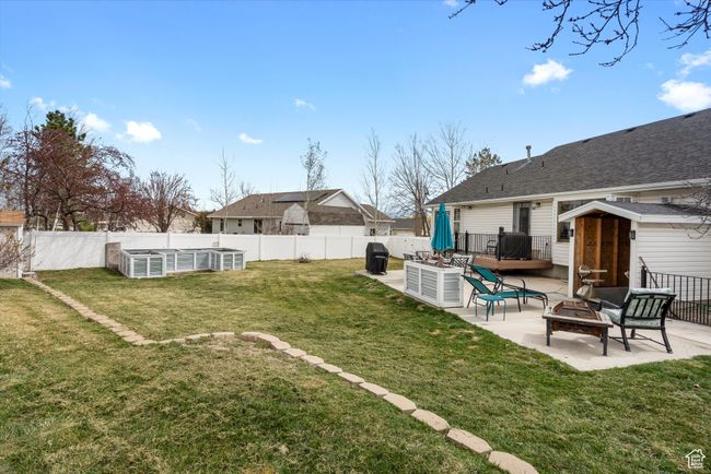 View of yard with a fenced backyard, a patio, raised garden or flower beds. Also the basement entrance is COVERED | Image 31