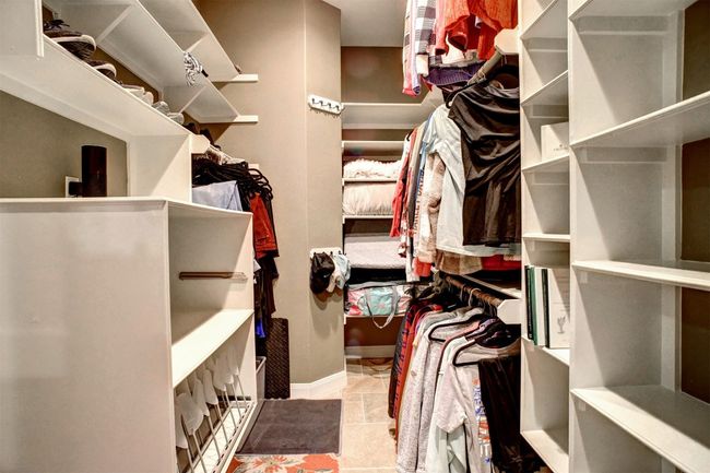One of the two primary walk-in closets | Image 17
